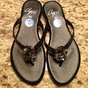 Black jeweled flip flops