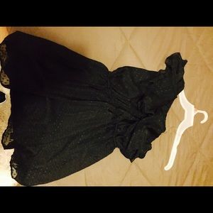 Black one shoulder dress.
