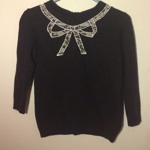 Sweater with white lace bow cut out