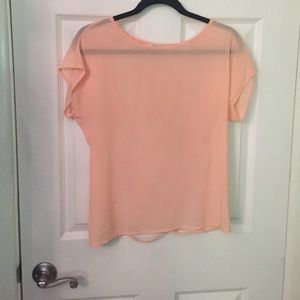 Sheer peach top with caged back