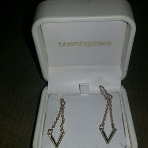 Gold earrings with v design and black accent