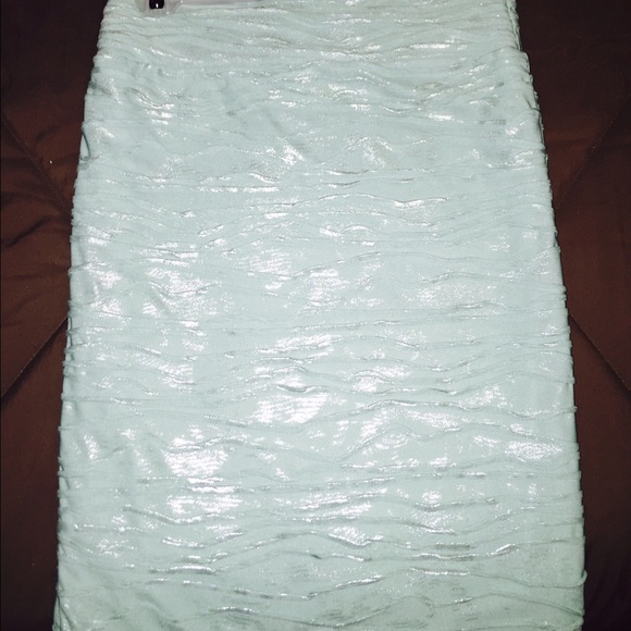 Greenish blue skirt.