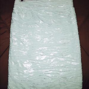 Greenish blue skirt.