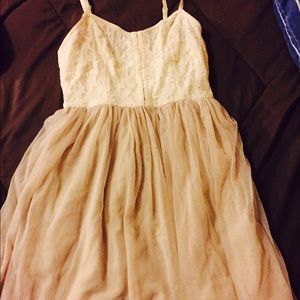 Lace top with tannish bottom dress.