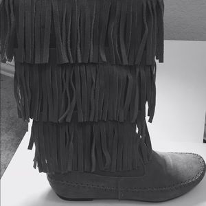 Fringed grey suede boots.