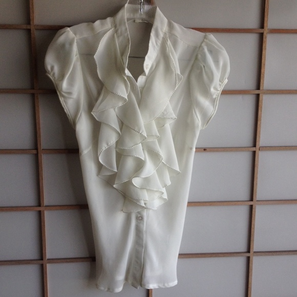 Cream blouse/top with ruffles