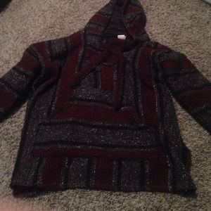 maroon, grey, and black drug rug