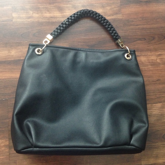 Black quality leather purse with gold accessory.