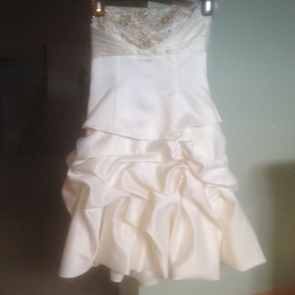 White and gold embroidered design on top