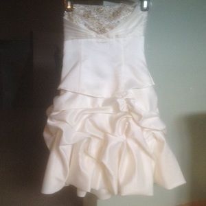 White and gold embroidered design on top