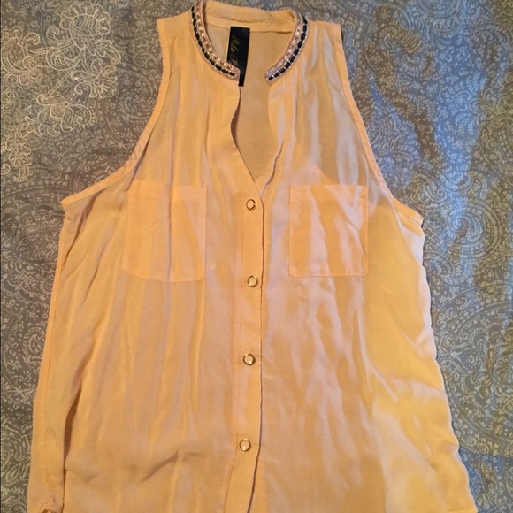 Peach sleeveless top with button down front