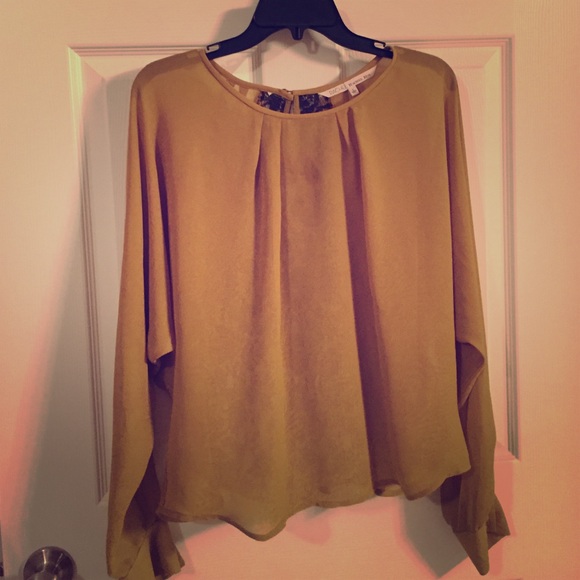 Olive colored flowy top with black lace detail