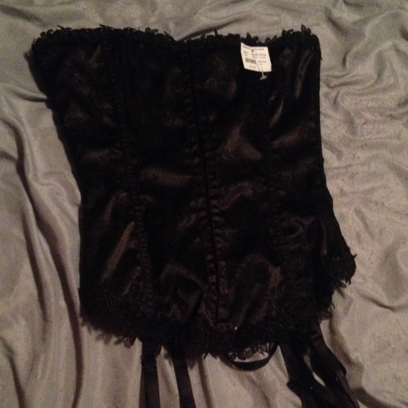 Frederick's Black, silky corset with g string.