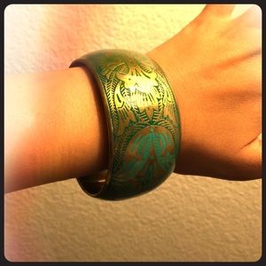 Gold bracelet with green and blue design