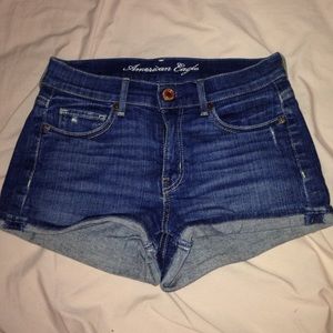 Mid waist dark wash denim American Eagle shorts.