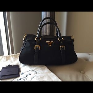 Authentic PRADA black nylon and leather bag .