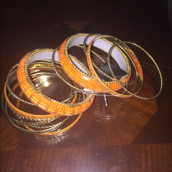Assorted set orange and gold bangles