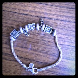 Pandora bracelt with charms that say I ❤️U, T,B.