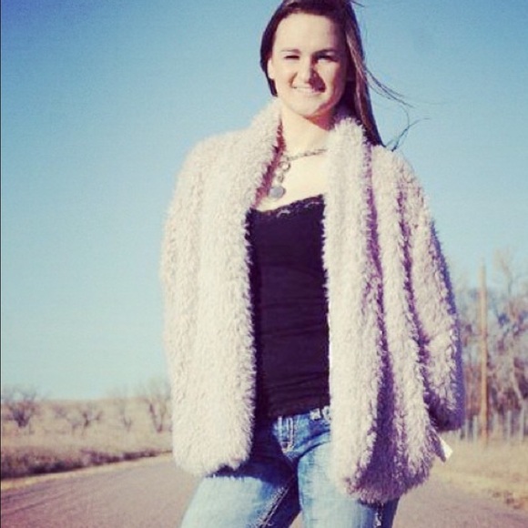 This is a lilac in color fur coat