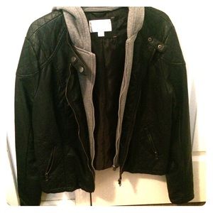 A leather jacket w/ grey sweater hood