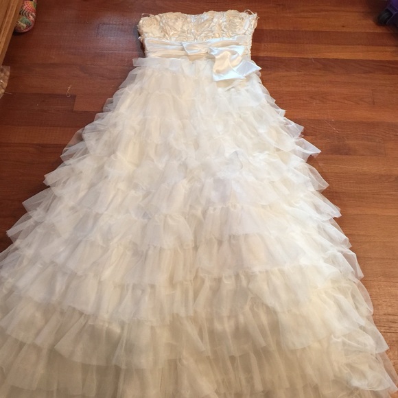 White layered prom dress with silk details.