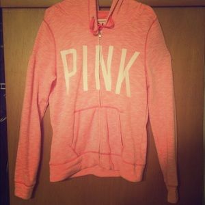 Pink zip up sweater/jacket.
