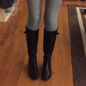 Tall black riding boots