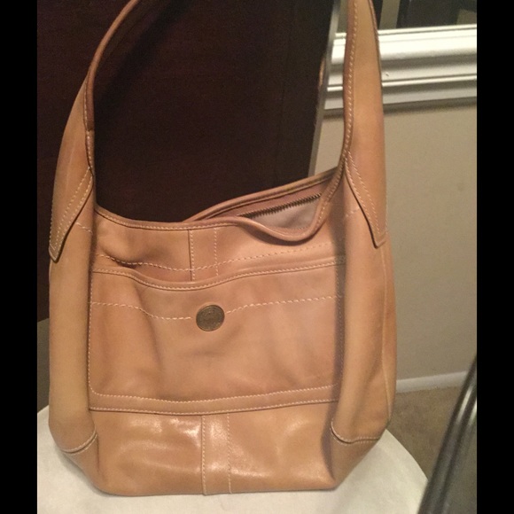 tan coach