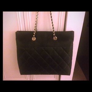 Black quilted bag with gold chain