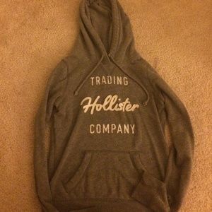 'Trading Hollister Company' gray hoodie.
