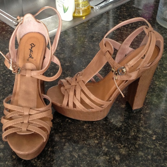 Tan strappy heels.