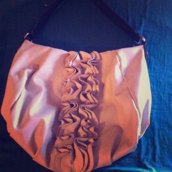 A grey and black purse ruffles down the center