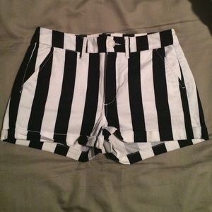 Black and white striped high wasted shorts.
