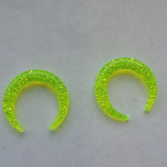 Yellow earrings gauges pinchers