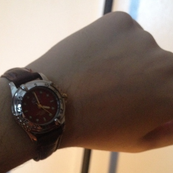 NIKE burgundy face and brown strap watch
