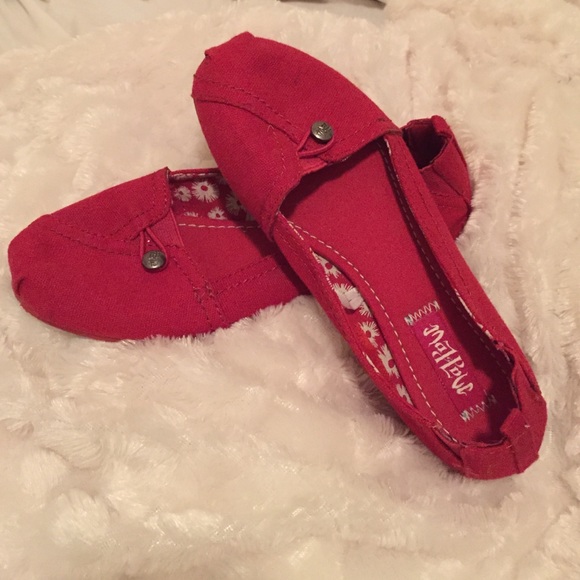 Red slip on sneakers