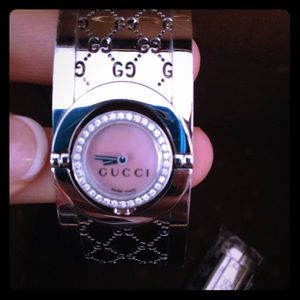 Gucci diamond bangle watch.