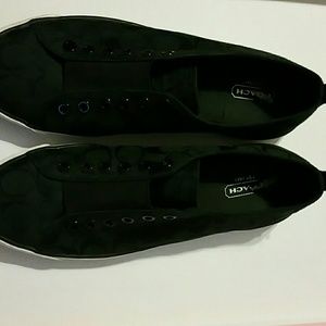 Slightly worn black Coach sneaker