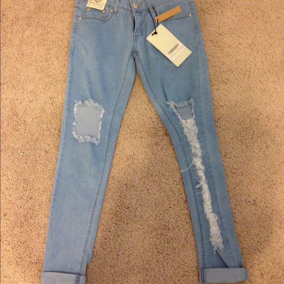 Ripped low rise skinny jeans.