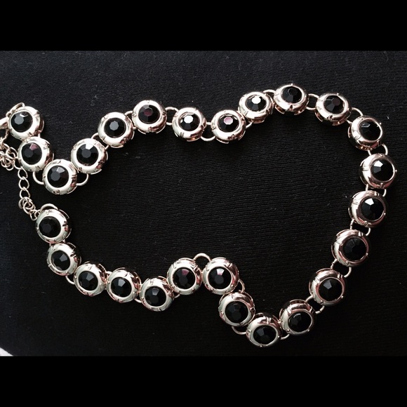 gold and black necklace