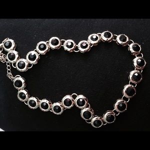 gold and black necklace