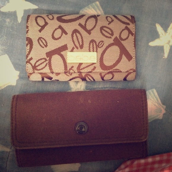 Two wallets, one Bebe the other one unknown.