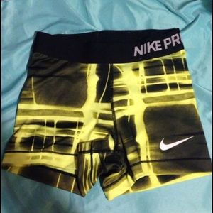 Yellow and black nike pro shorts