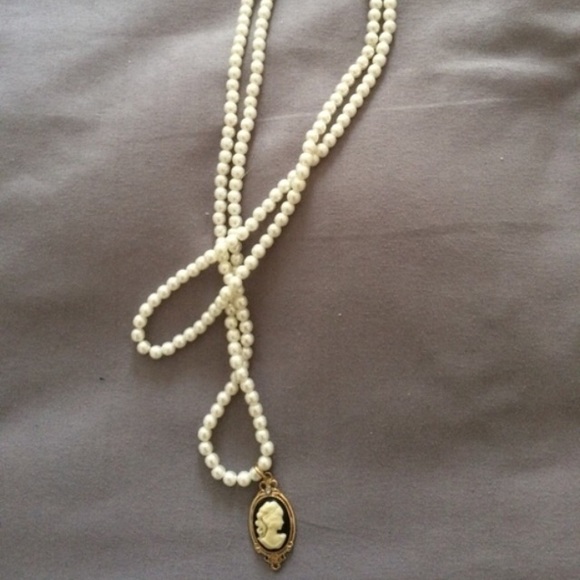 Elegant pearl necklace with a charm