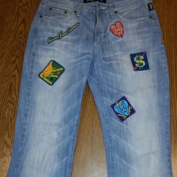 Versace faded denim jeans with patches