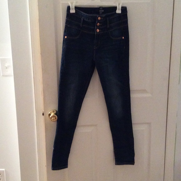 High-waisted denim jeans.