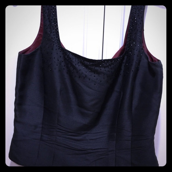 Black dressy top with maroon interior and design