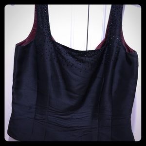 Black dressy top with maroon interior and design