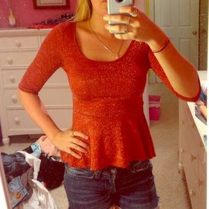 Red shimmery peplum top