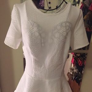White crocodile print peplum top.